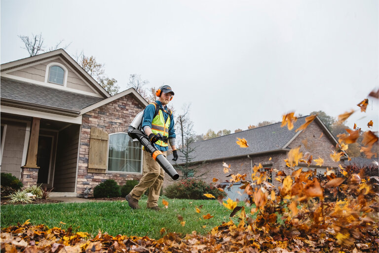 Stihl BR800X backback blower moving leaves in a yard