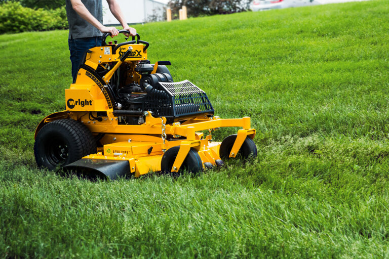 Wright stand on mower in grass
