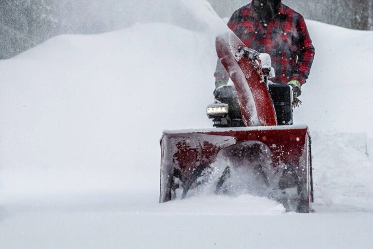 Man blowing snow with Toro Power Max snow blower