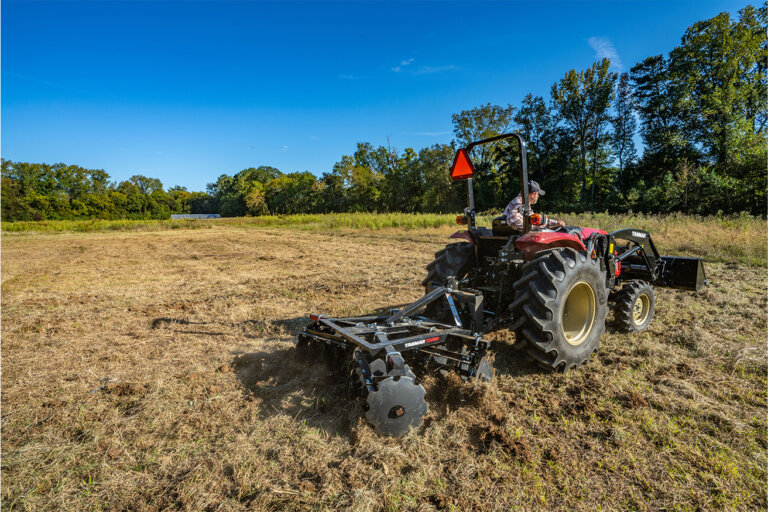 Yanmar tractor working in field