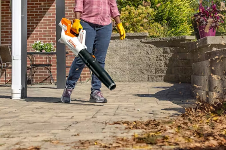 Stihl BGA 60 blowing leaves off a patio