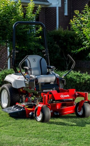 Exmark Radius zero turn mower in front of house