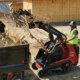 Dingo TX1000 Turbo compact track loader loading debris