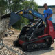 Dingo TX1000 Turbo compact track loader moving rocks