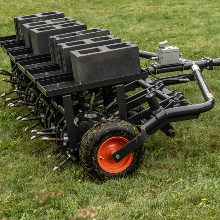 Bobcat AE72 tow behind aerator close up side view