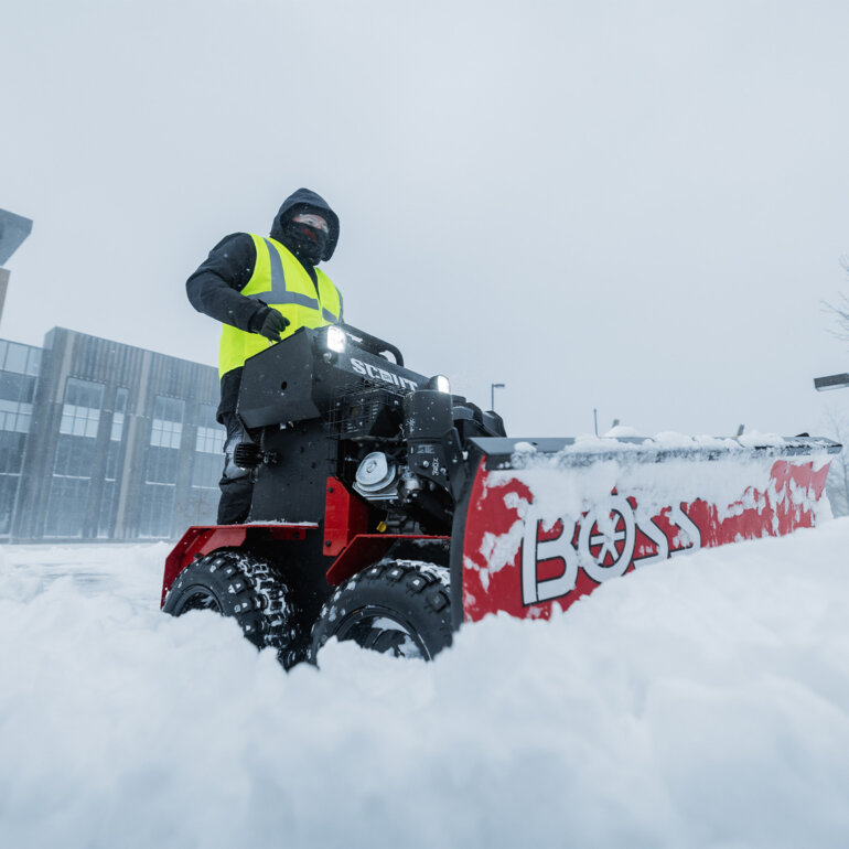 Man clearing snow with BOSS SR Scout plow