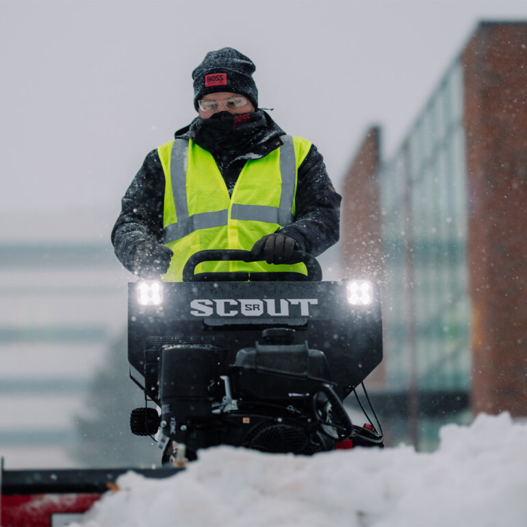 Front view of BOSS SR Scout clearning snow