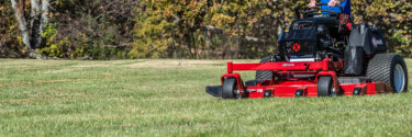 Exmark Vertex stand-on mower cutting grass