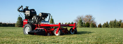 Exmark Turf Tracer walk behind mower in lawn