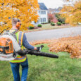 Landscaper blowing leaves Stihl backpack blower