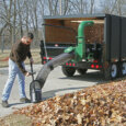Billy Goat debris loader cleaning leaves from lawn
