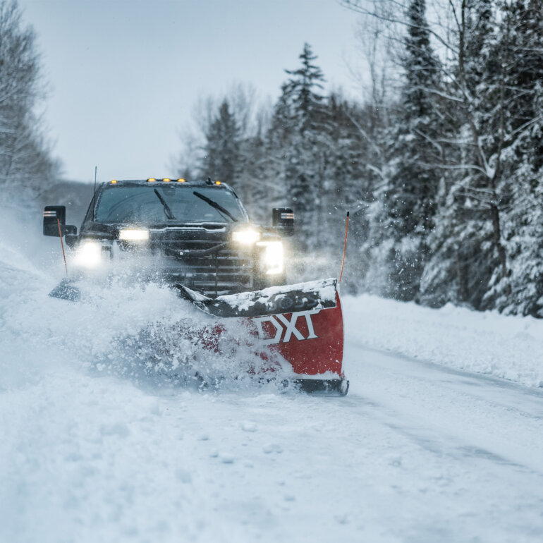 BOSS DXT snow plow on snowy road clearing snow