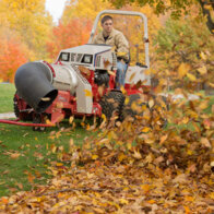Ventrac 4520 tractor with blower attachment blowing leaves
