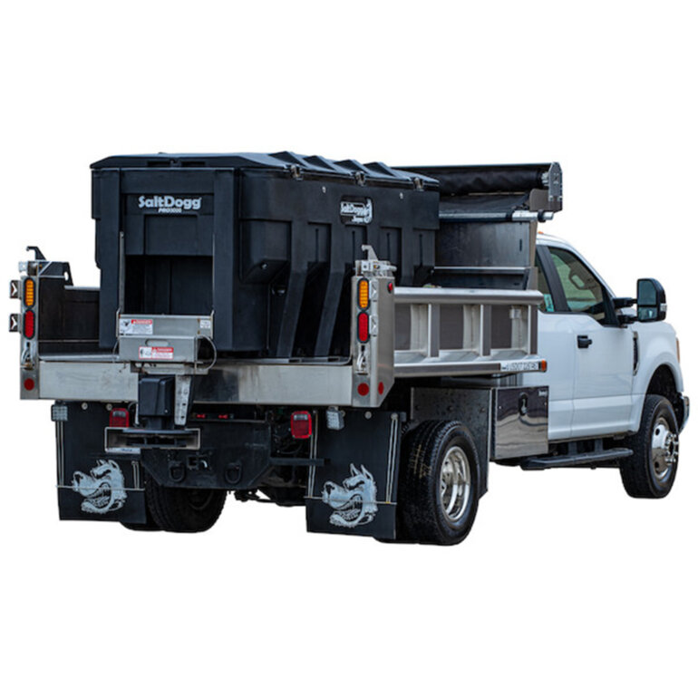 SaltDogg PRO3000 salt spreader in the back of a heavy duty truck on a white background