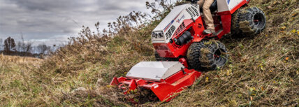 Ventrac 4520 PRO tractor on a steep hillside cutting brush