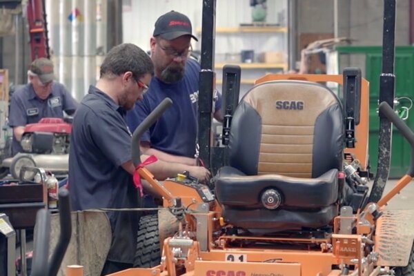 Man giving a demo of a Scag mower