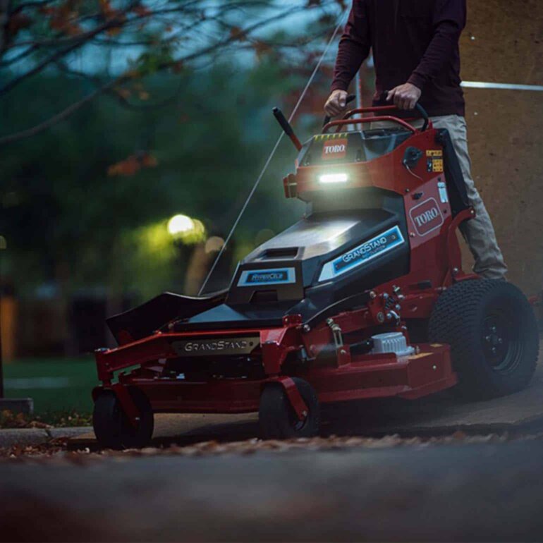 Toro Revolution GrandStand stand-on mower with headlight on