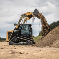 ASV track loader dumping dirt