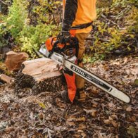 Stihl chain saw cutting log