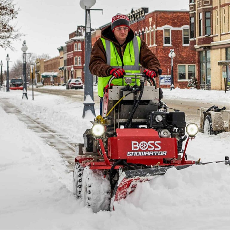 BOSS Snowrator plowing snow from sidewalk