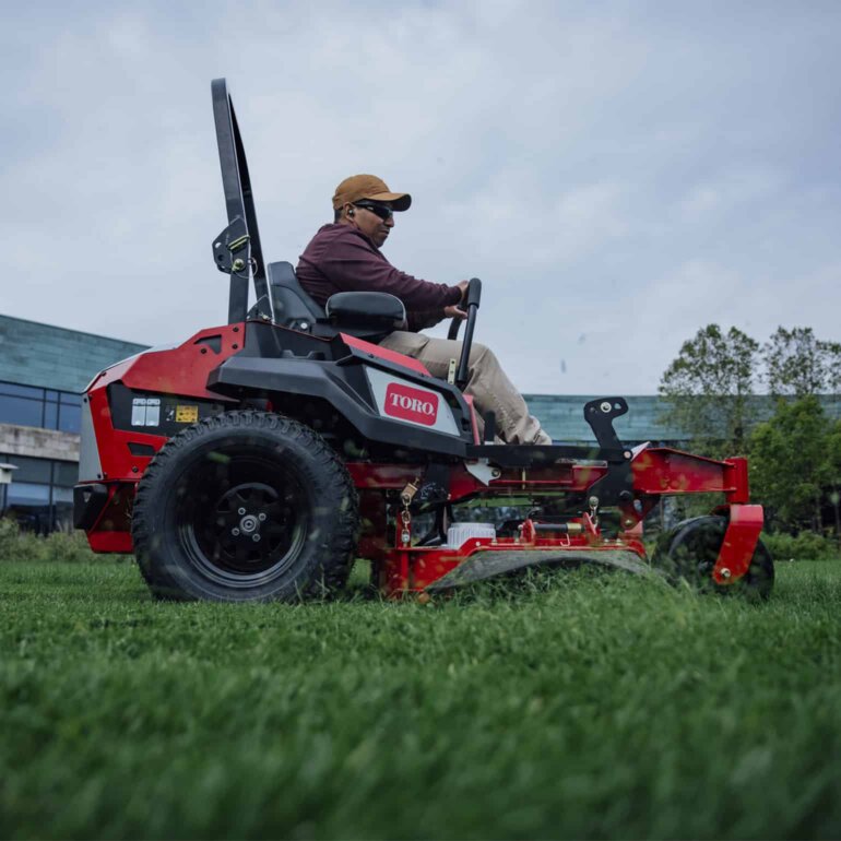 Toro Revolution zero turn cutting grass