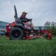 Toro Revolution zero turn cutting grass